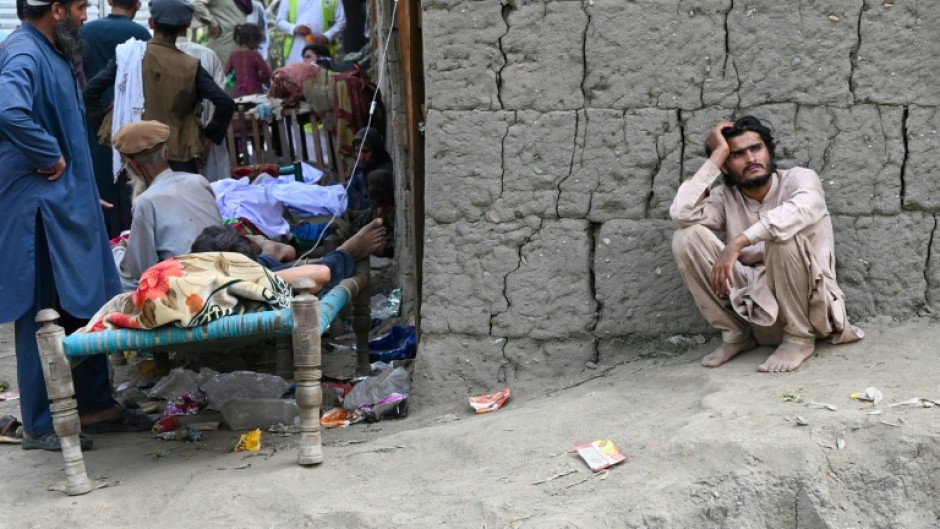 Villagers used their bare hands to clear debris as emergency workers struggled to reach mountainous areas after an earthquake in eastern Afghanistan killed more than 1,400 people