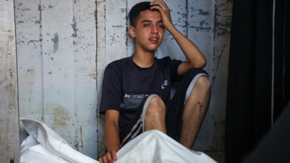 Palestinians mourned over their loved ones at Gaza City's Al-Shifa Hospital following overnight strikes