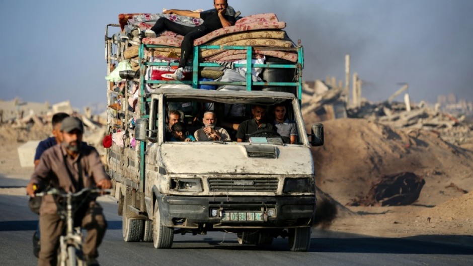Palestinians flee south on the coastal road in central Gaza last month. Most Gazans have been displaced at least once during the war