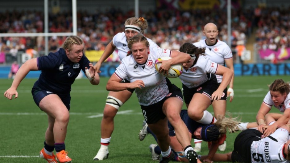 Canada hooker Emily Tuttosi runs in a try during a 40-19 Women's Rugby World Cup Pool B win over Scotland in Exeter