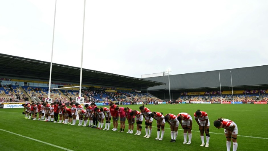 The Japan team and coaches bow to their fans after a 29-21 Women's Rugby World Cup Pool C win over Spain in York