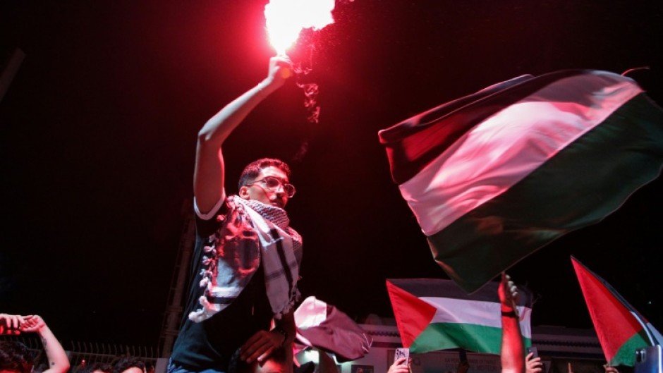 Tunisian protesters shout anti-Israeli slogans and wave Palestinian flags at the Port of Sidi Bou Said near Tunis on September 9, 2025