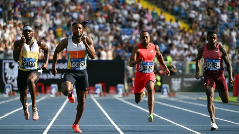 Jamaican athletics legend Usain Bolt fancies his compatriots including Olympic silver medallist Kishane Thompson (2L) can beat defending world champion Noah Lyles in the 100 metres