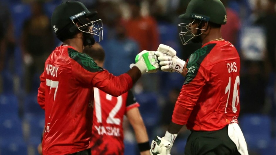 Bangladesh captain Litton Das (R) and Towhid Hridoy bump their fists during their Asia Cup win against Hong Kong