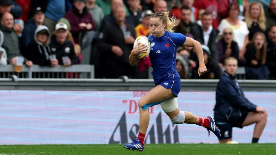France's wing Joanna Grisez runs to score a try during an 18-13 Women’s Rugby World Cup quarter-final win over Ireland at Exeter