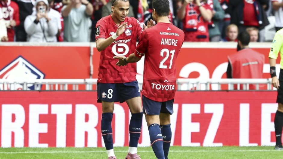 Ethan Mbappe (L) celebrates with Benjamin Andre after grabbing a late winner for Lille against Toulouse