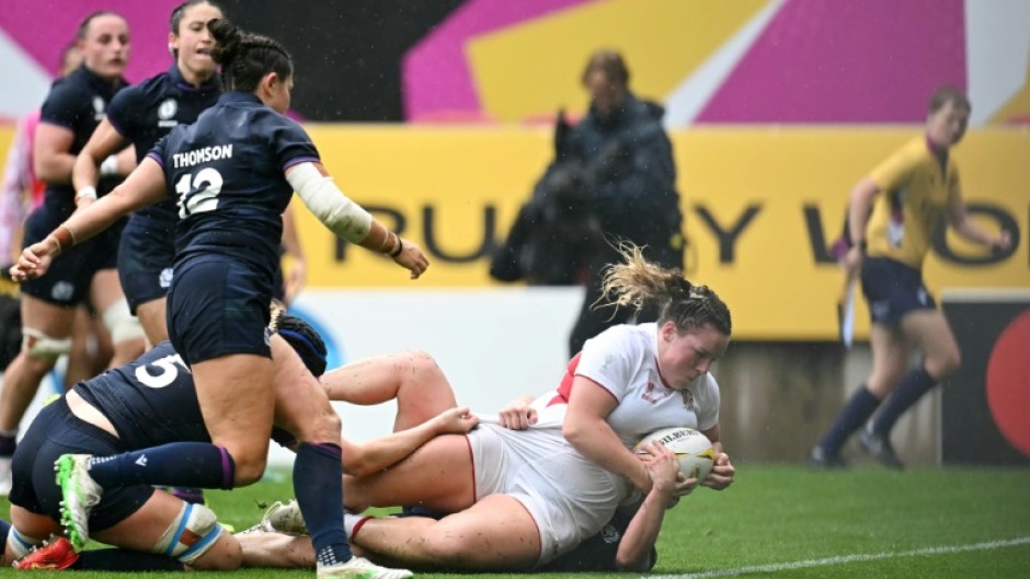 England prop Kelsey Clifford tumbles over the line to score a try during a 40-18 Women's Rugby World Cup quarter-final win over Scotland in Bristol