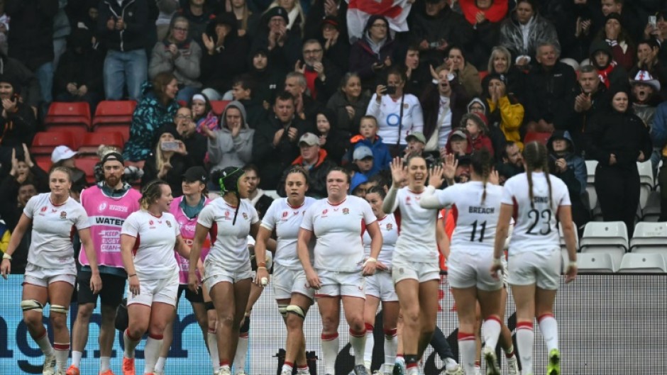 England players celebrate their 40-8 Women's Rugby World Cup quarter-final win over Scotland in Bristol