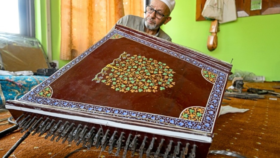 Generations of artisans in Indian-administered Kashmir have been making musical instruments such as the santoor, a zither-like, hundred-stringed instrument
