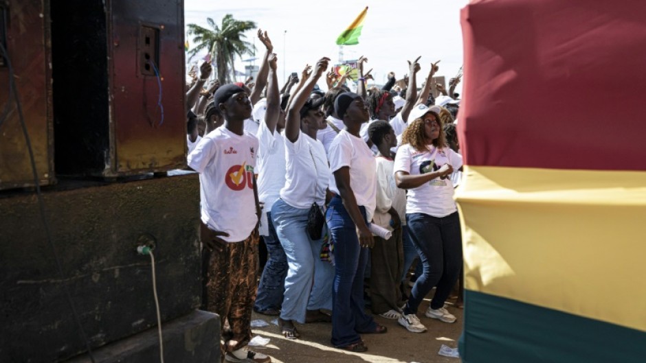 Those in favour of a 'yes' vote in Guinea's constitutional referendum dance and sing during at an event at Conakry's Palace of the People event space, on September 18, 2025