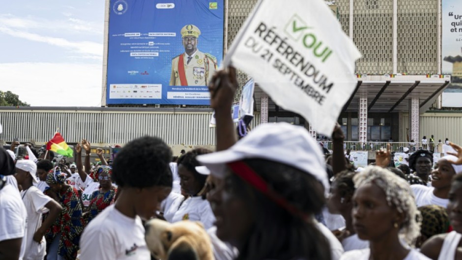 A billboard of Guinea President Mamady Doumbouya is seen during a "yes" vote rally at the People's Palace in Conakry on September 18, 2025