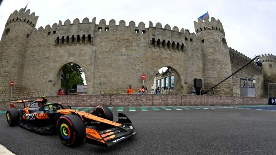 Lando Norris negotiates the Baku street circuit in practice for the Azerbaijan Grand Prix