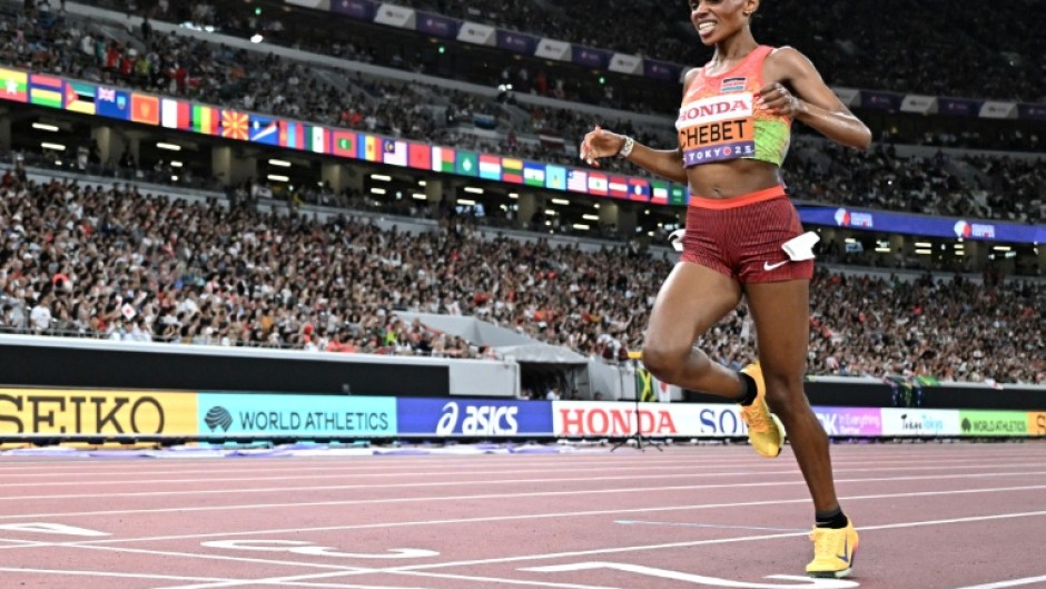 Kenya's Beatrice Chebet crosses the finish line to win the women's 5,000m