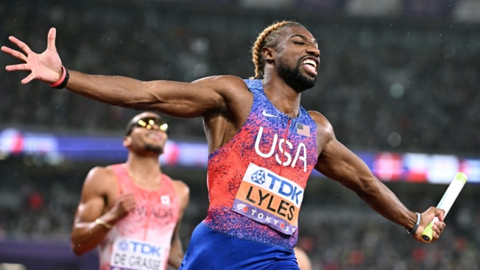 USA's Noah Lyles crosses the finish line to win the men's 4x100m relay final