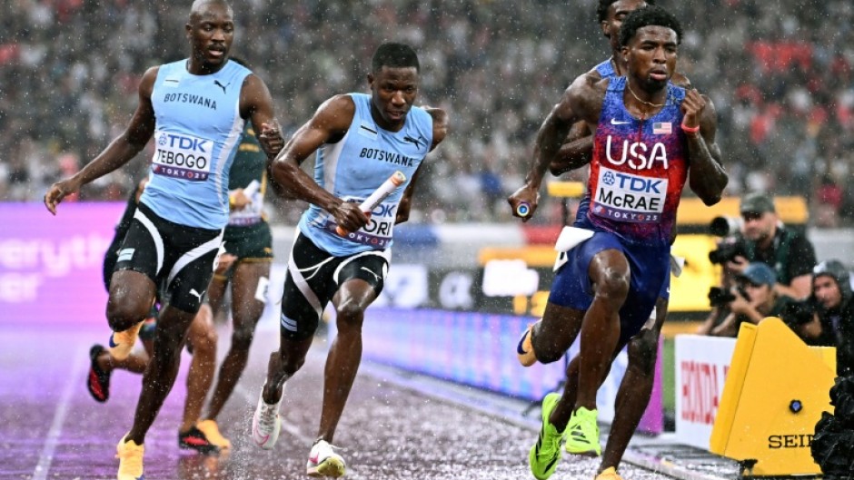 (From L) Botswana's Letsile Tebogo, Botswana's Bayapo Ndori, US' Jacory Patterson and US' Khaleb McRae compete in the men's 4x400m relay final