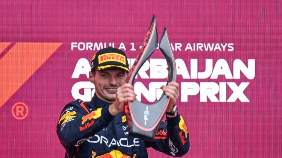 Max Verstappen collects his trophy in Baku
