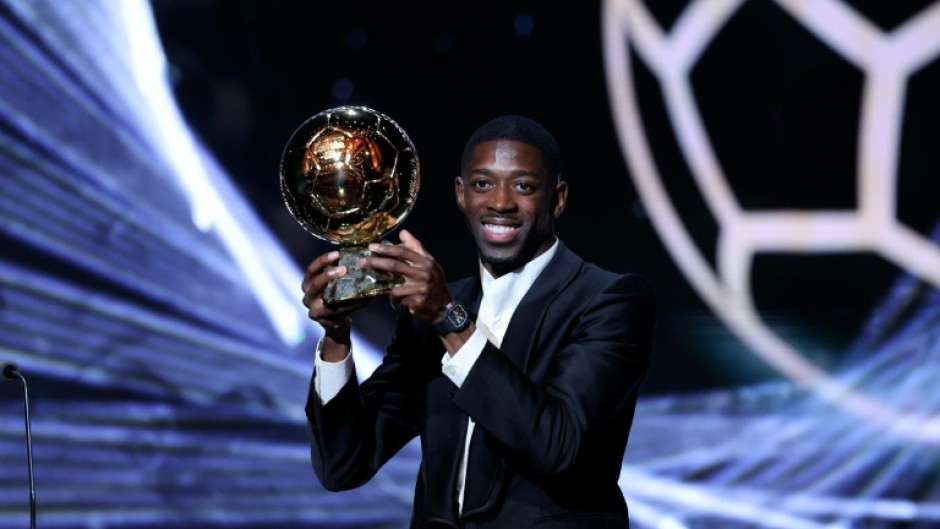 Paris Saint-Germain's Ousmane Dembele with the trophy after winning the men's Ballon d'Or on Monday