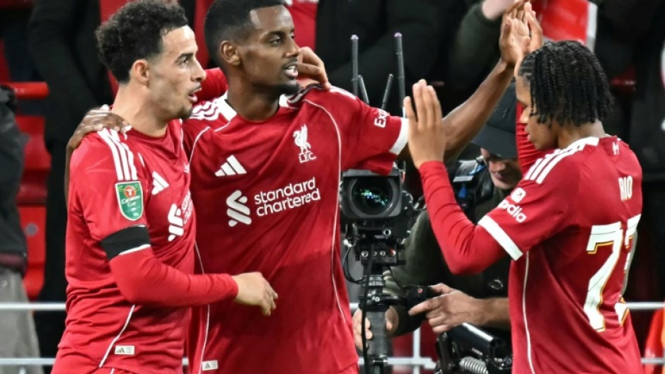 Liverpool striker Alexander Isak (C) celebrates scoring his first goal for the club