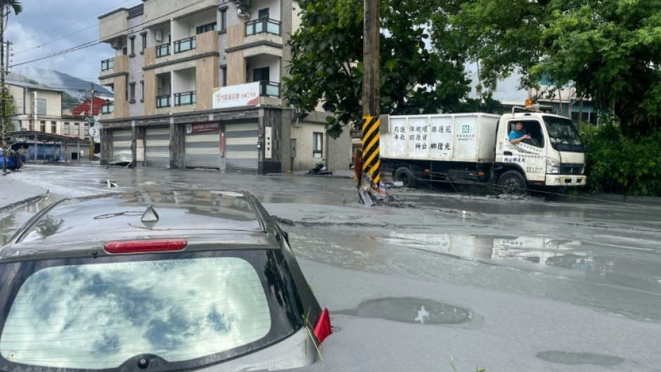 A car stuck in mud in Hualien after the bursting of a barrier lake