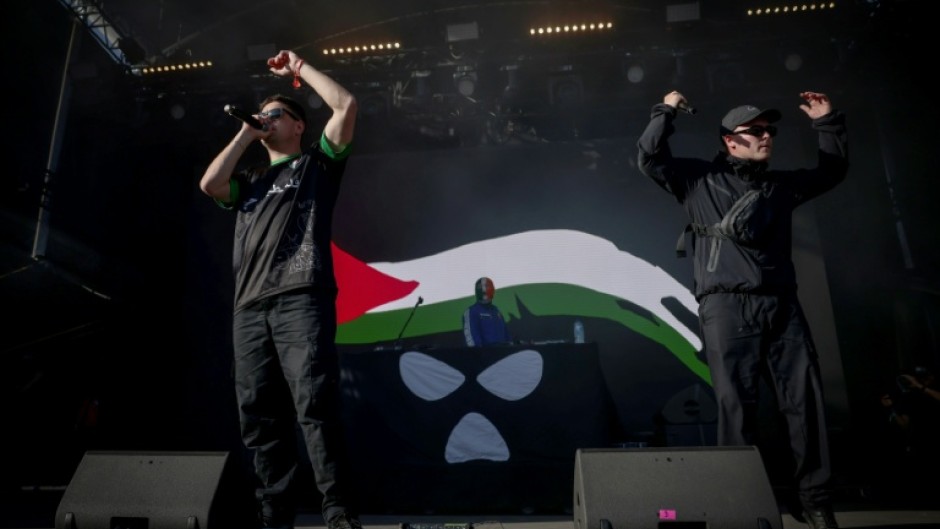 Northern Ireland hip-hop trio Kneecap perform on stage at a music festival outside Paris