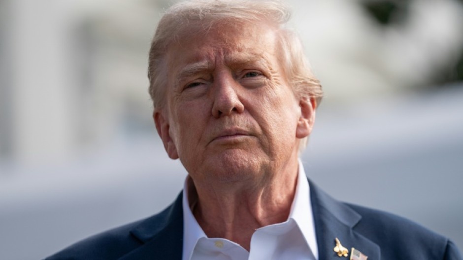 US President Donald Trump speaks to the press before boarding Marine One as he departs from the South Lawn of the White House in Washington, DC, on September 26, 2025, en route to attend the Ryder Cup.