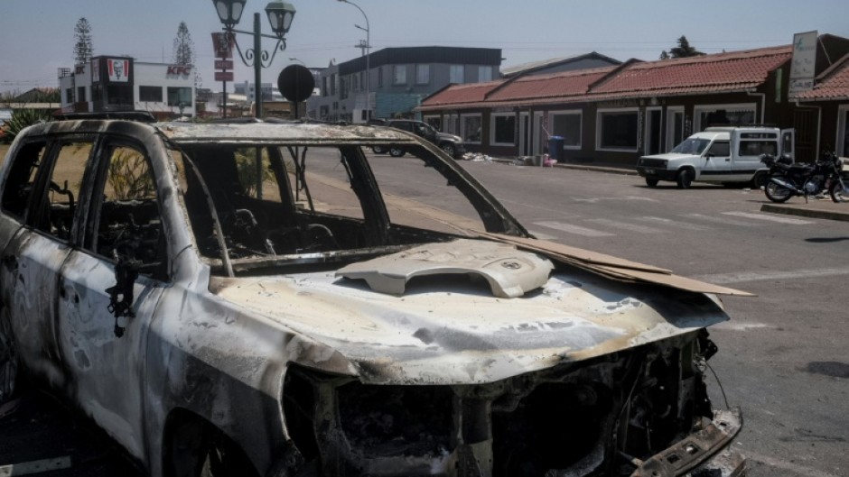 The protest left burnt-out cars strewn across the streets of Madagascar's capital