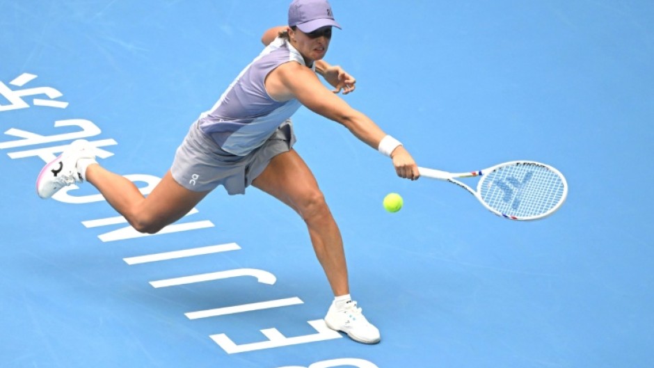 Poland’s Iga Swiatek hits a return to China’s Yuan Yue