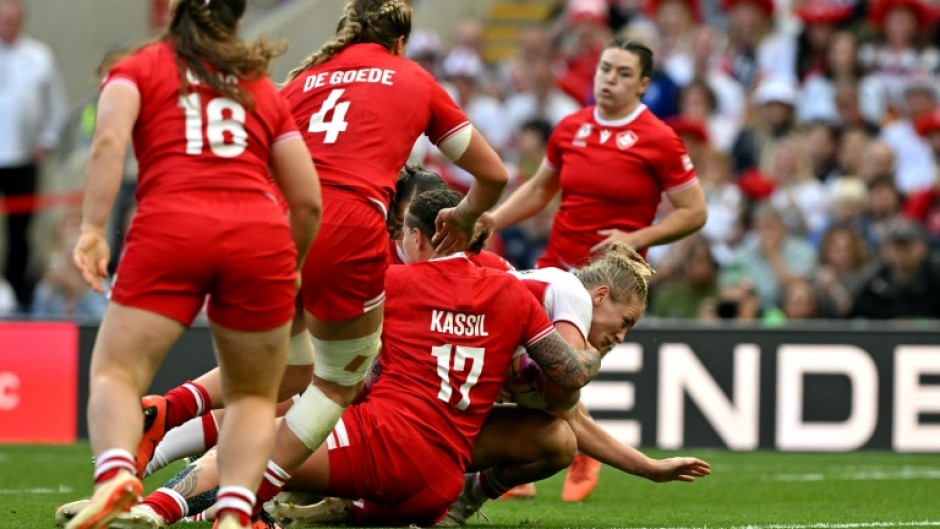 England No 8 Alex Matthews dives to score her second try in the Women's Rugby World Cup final against Canada at Twickenham