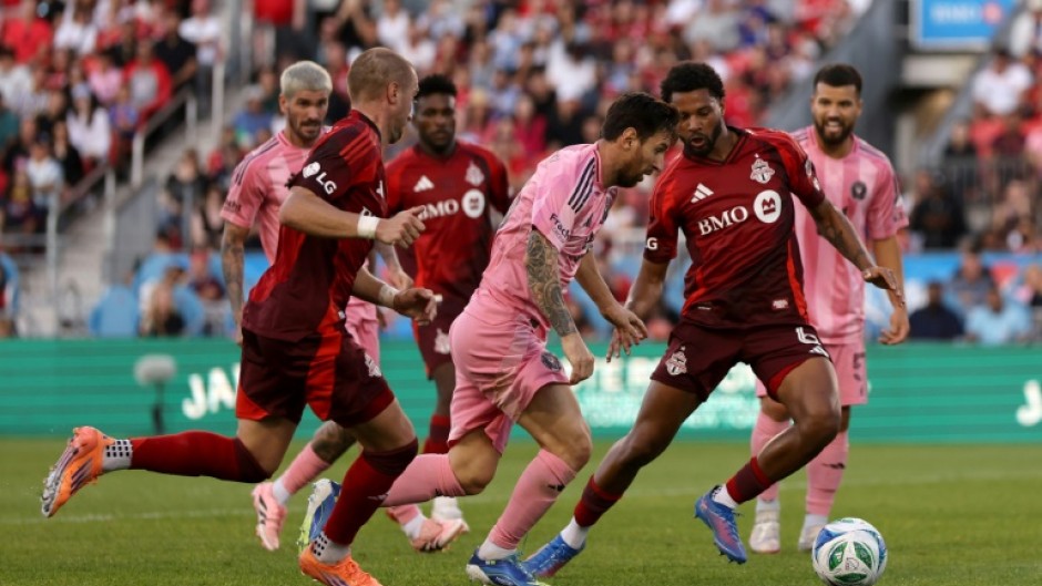 Inter Miami's Lionel Messi attempts to evade Toronto's Kosi Thompson in their 1-1 draw in Major League Soccer
