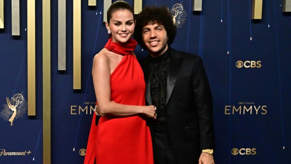 US actress Selena Gomez (L) and her fiance producer Benny Blanco, seen here on the Emmy Awards red carpet, got engaged in December 2024