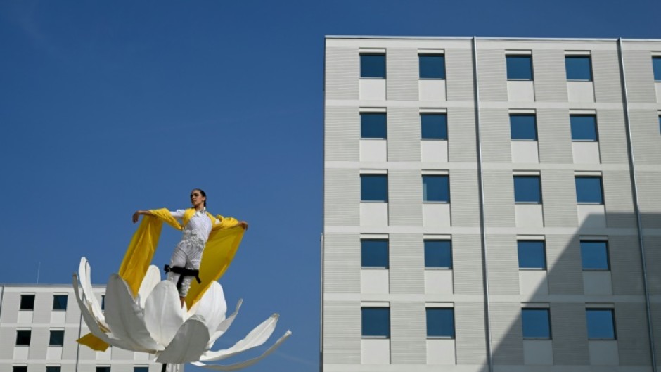 Artists perform in the Olympic and Paralympic Village of the 2026 Milano-Cortina Winter Olympics on the day of its official presentation