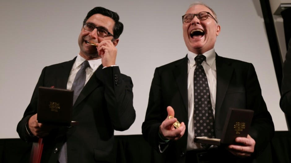 David Card (right) attended school in rural Canada, often listening in to what older classes were learning