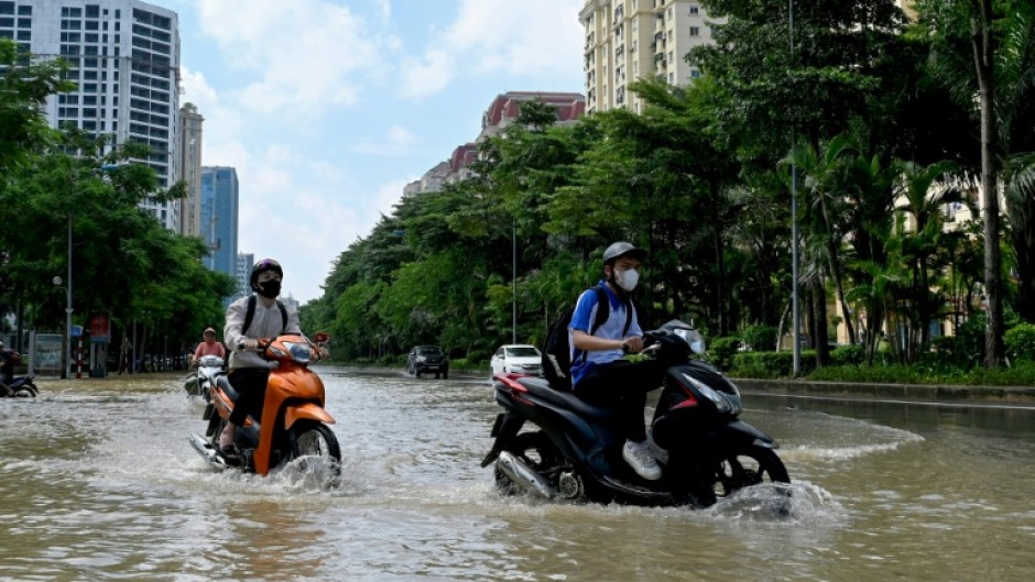Heavy rain from the storm inundated the capital Hanoi this week, and floods and landslides damaged homes, infrastructure and farmland across the country