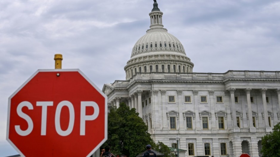 A stop sign is seen in front of the US Capitol -- where talks to repoen the federal government have seen little progress