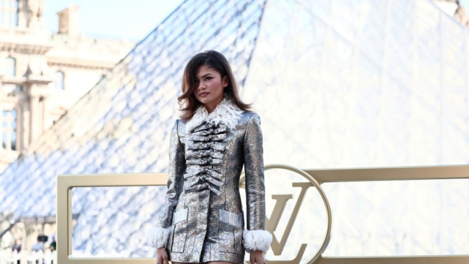 US actress Zendaya poses in front of the Louvre pyramid during a photocall ahead of Louis Vuitton's show