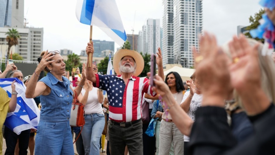 People waved Israeli and US flags in Tel Aviv's Hostages Square