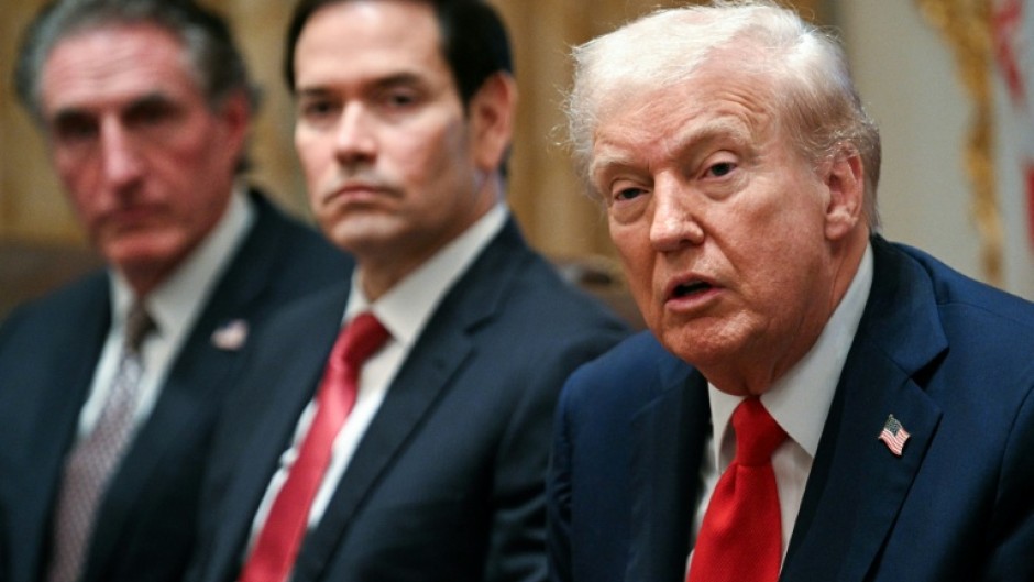 US President Donald Trump speaks alongside Secretary of the Interior Doug Burgum (L) and Secretary of State Marco Rubio (R) during a cabinet meeting in the Cabinet Room of the White House in Washington, DC, on October 9, 2025. Trump said Thursday he would try to go to Egypt for the signing of a Gaza ceasefire and hostage release deal between Israel and Hamas.
