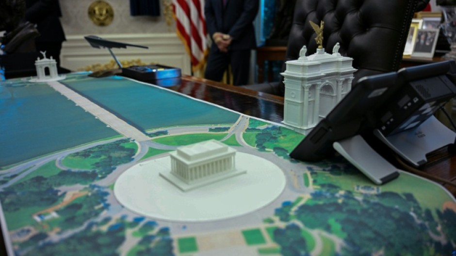 A plan for an arch across from the Lincoln Memorial is seen on the Resolute Desk as US President Donald Trump meets with Finnish President Alexander Stubb and Prime Minister Petteri Orpo in the Oval Office of the White House in Washington, DC, on October 9, 2025.