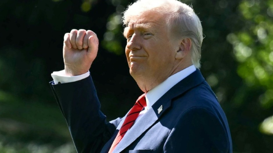 US President Donald Trump gestures as he walks to Marine One on the South Lawn of the White House in Washington, DC, on October 10, 2025, on his way to Walter Reed National Military Medical Center to receive a medical checkup.