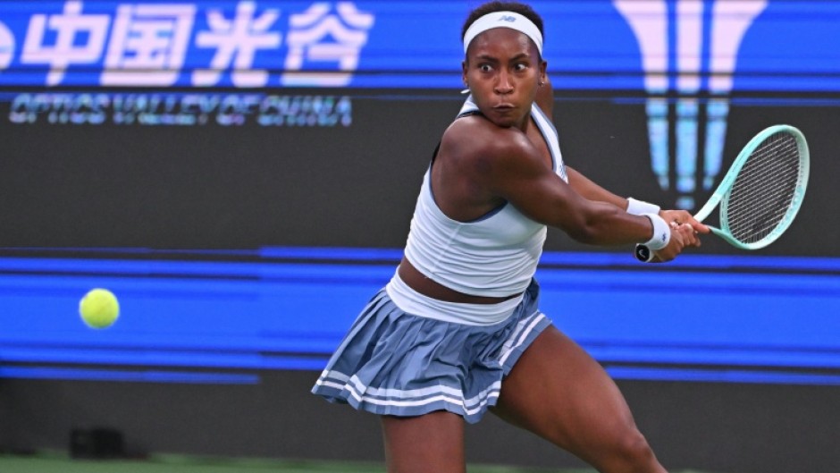Coco Gauff hits a return to Italy’s Jasmine Paolini