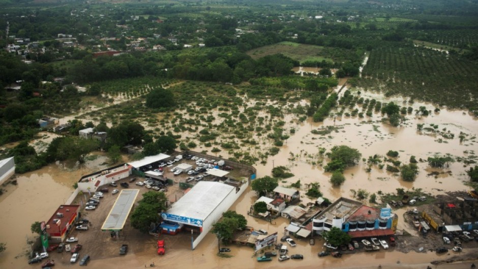 This aerial view taken during a Mexican Navy flyover shows flooded streets after heavy rains in Poza Rica, in Veracruz state