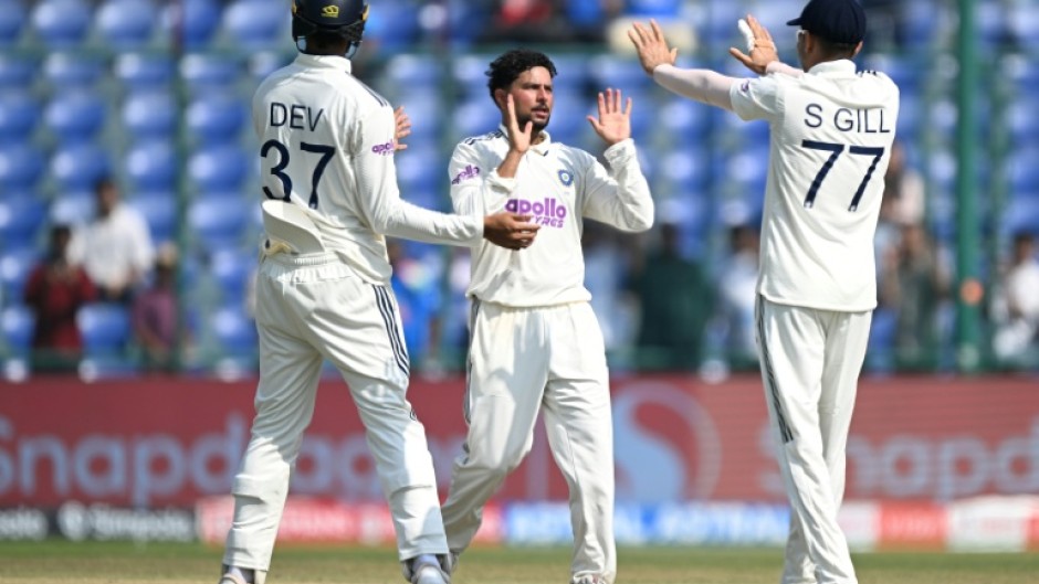 India's Kuldeep Yadav (centre) celebrates after taking the wicket of the West Indies' Justin Greaves