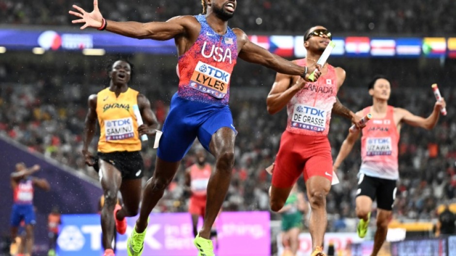Noah Lyles (C) anchored the USA 4x100 metre relay team to gold at the World Athletics Championships in Tokyo