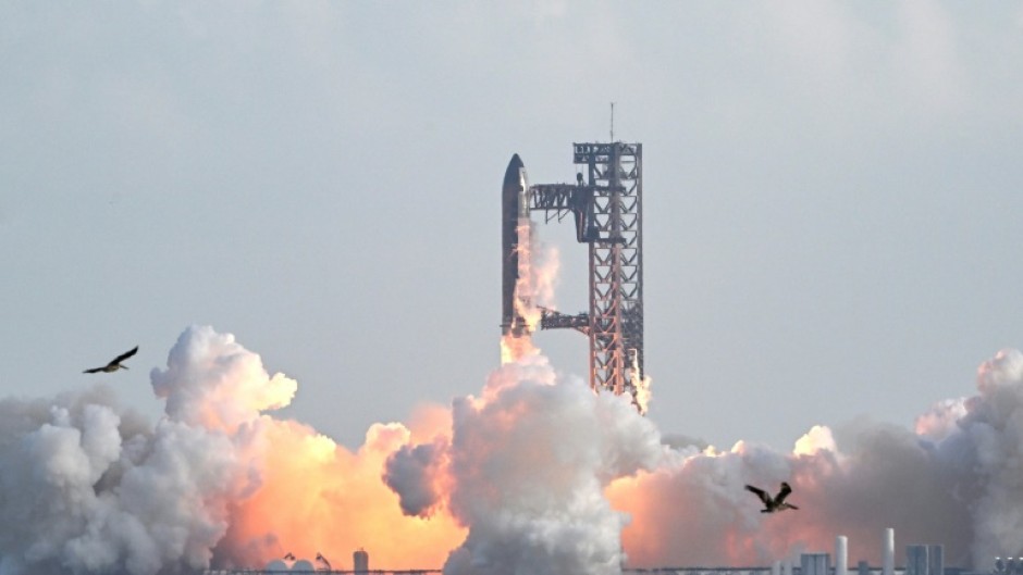 SpaceX's Starship rocket 38 launches during the 11th test flight on October 13, 2025 as seen from South Padre Island in Texas