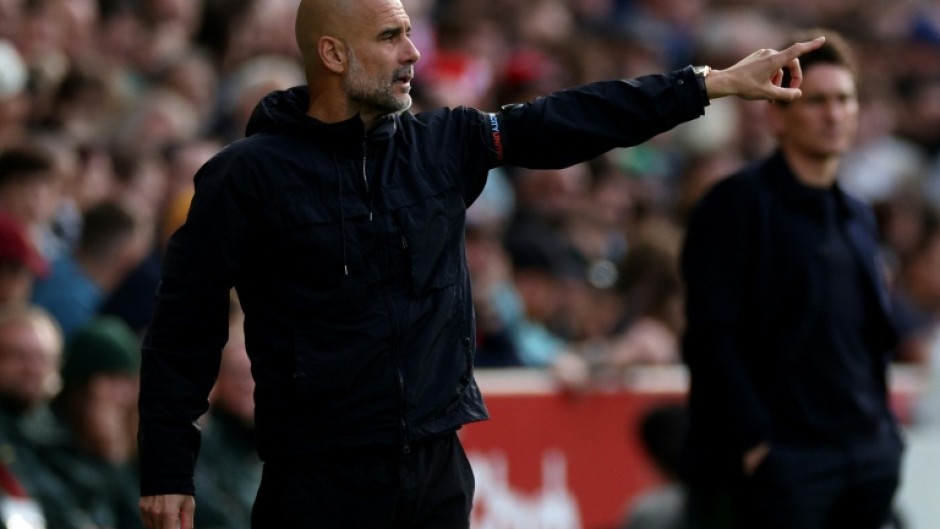 Pep Guardiola said he has "unfinished business" at Manchester City