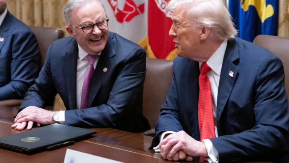US President Donald Trump (R) speaks with Australia's Prime Minister Anthony Albanese in the Cabinet Room at the White House
