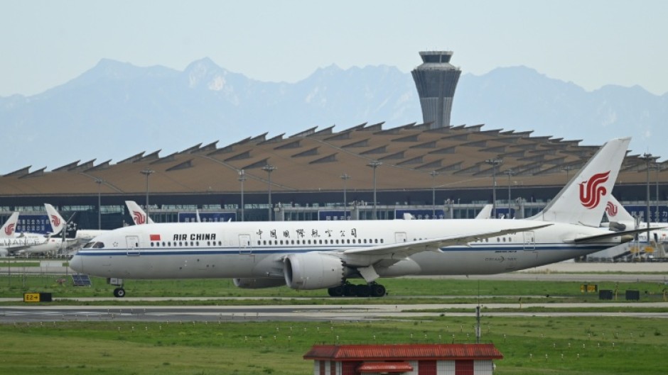 An Air China flight was safely diverted to Shanghai after a battery stowed in a passenger's carry-on luggage caught fire