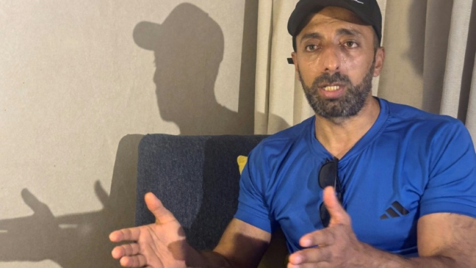 Murad Abu al-Rub, an exiled Palestinian prisoner in Egypt, speaks to AFP from his hotel room