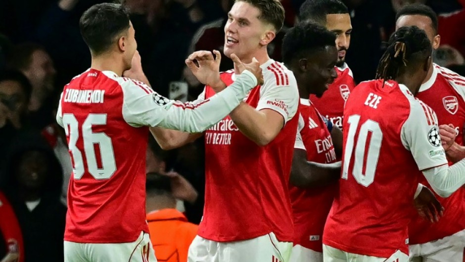 Arsenal striker Viktor Gyokeres (C) celebrates with team-mates at the Emirates Stadium after scoring their fourth goal during a 4-0 win over Atletico Madrid in the Champions League