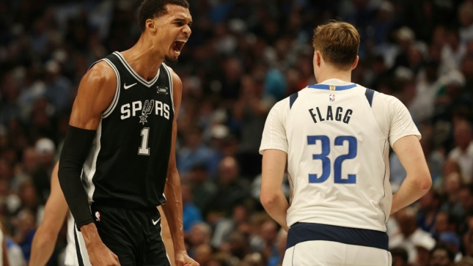 Victor Wembanyama (L) is officially listed this season at 7 feet 4 inches -- about 2.24 meters -- making him the tallest player in the league, tied with Memphis center Zach Edey